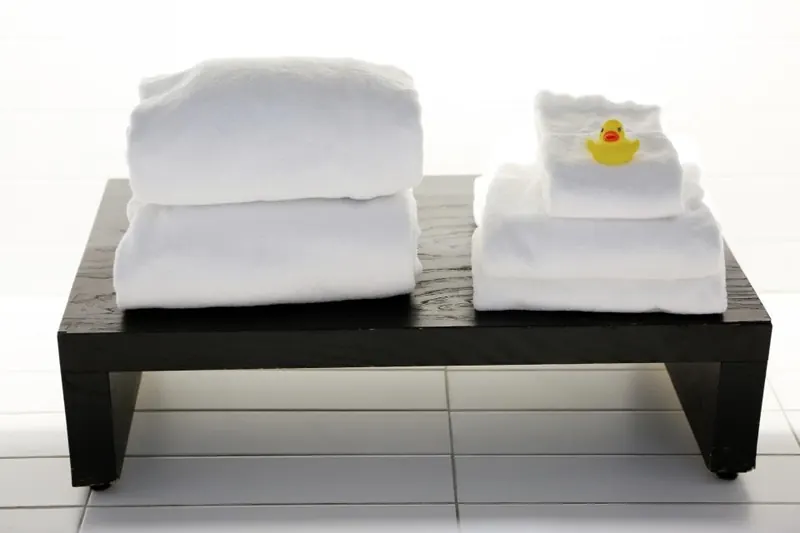 Fresh rolled towels ready for a spa pedicure