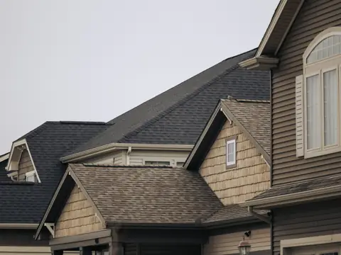 Row of homes with brown architectural shingle roofs
