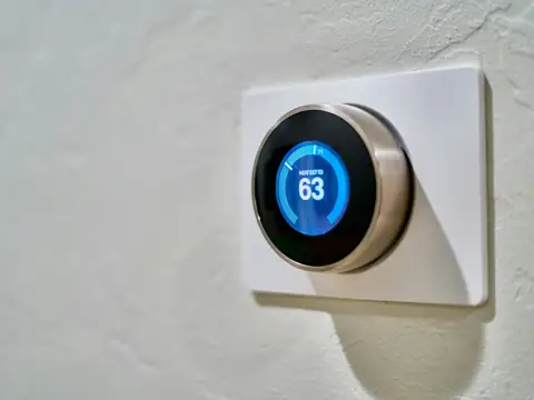 Smart thermostat on a wall